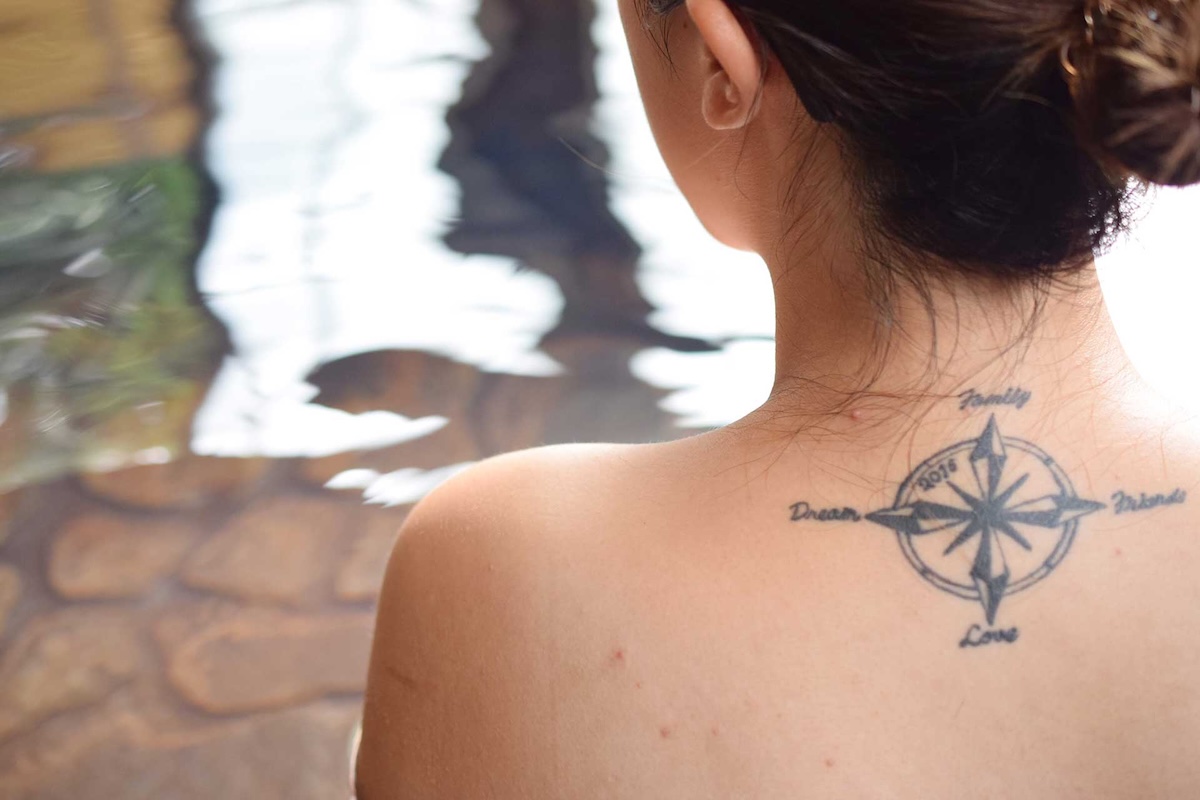Traditional Japanese tattoo art with waves and cherry blossoms